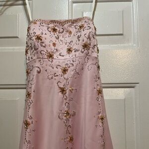 Pink prom/pageant dress. Dress has been worn multiple times.